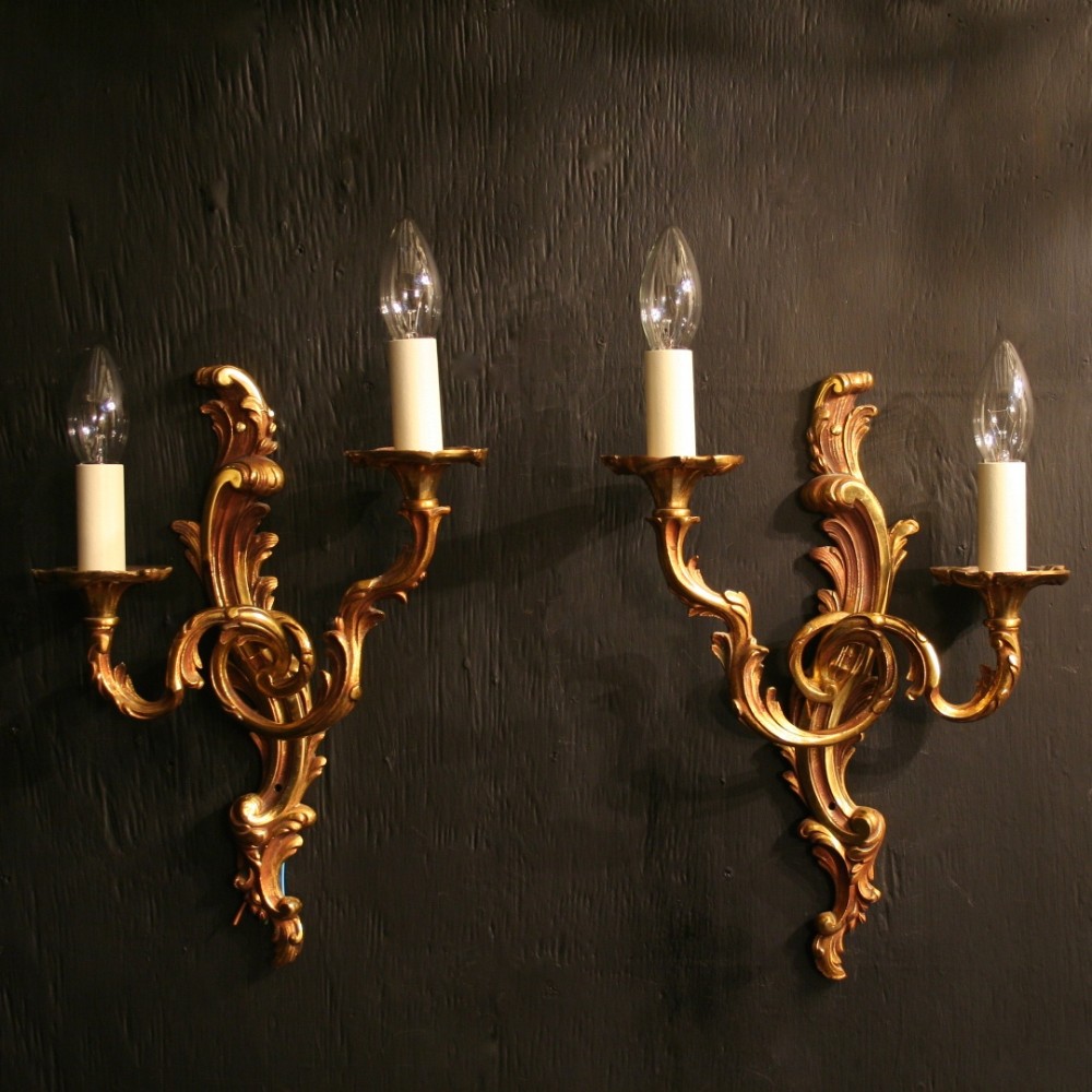 A French Pair Of Gilded Twin Arm Wall Lights