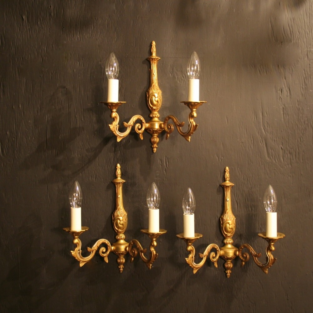 A French Set Of Three Gilded Twin Arm Antique Wall Lights