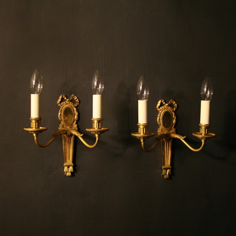 A French Pair Of Bronze Twin Arm Antique Wall Lights
