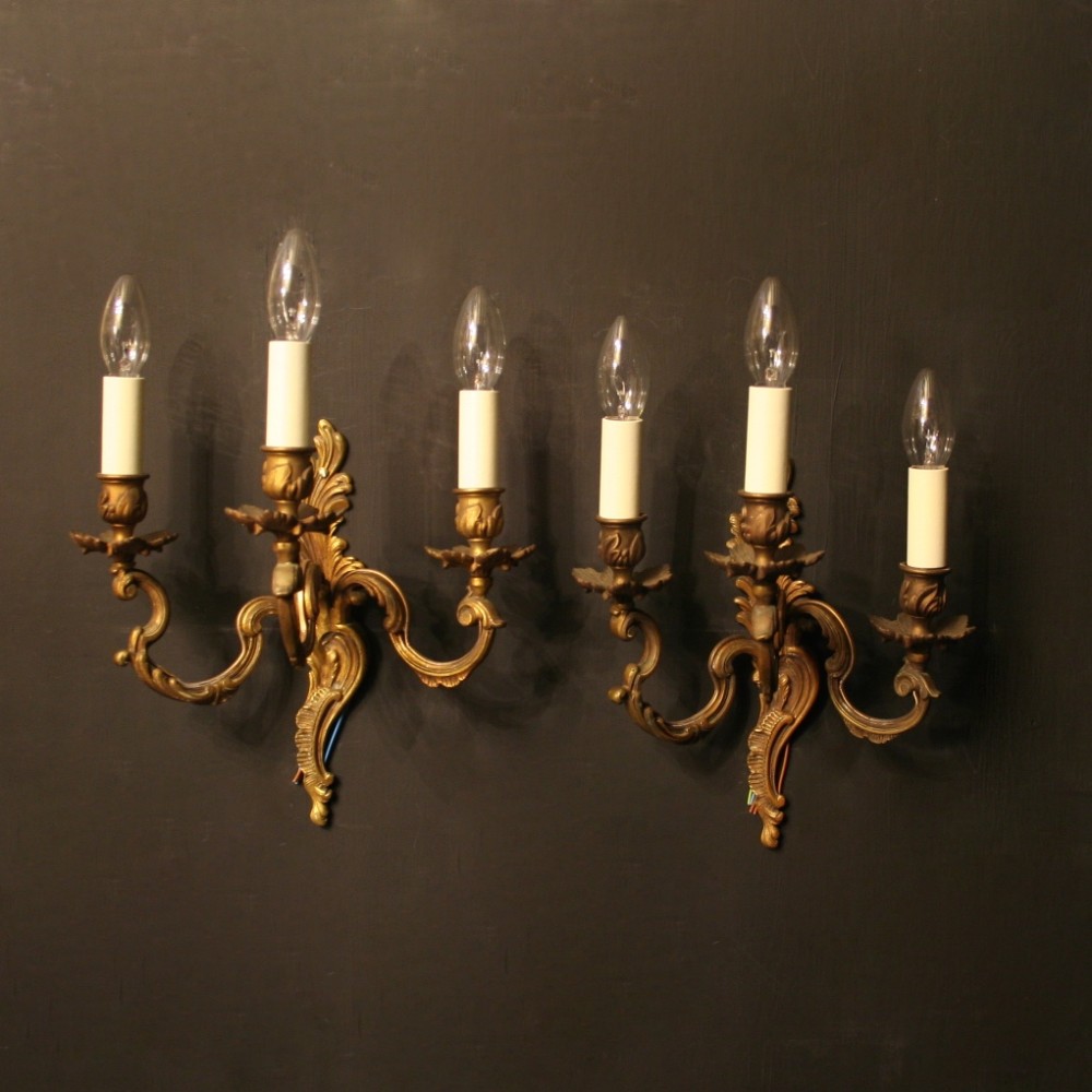 A French Pair Of Gilded Brass Triple Arm Wall Lights