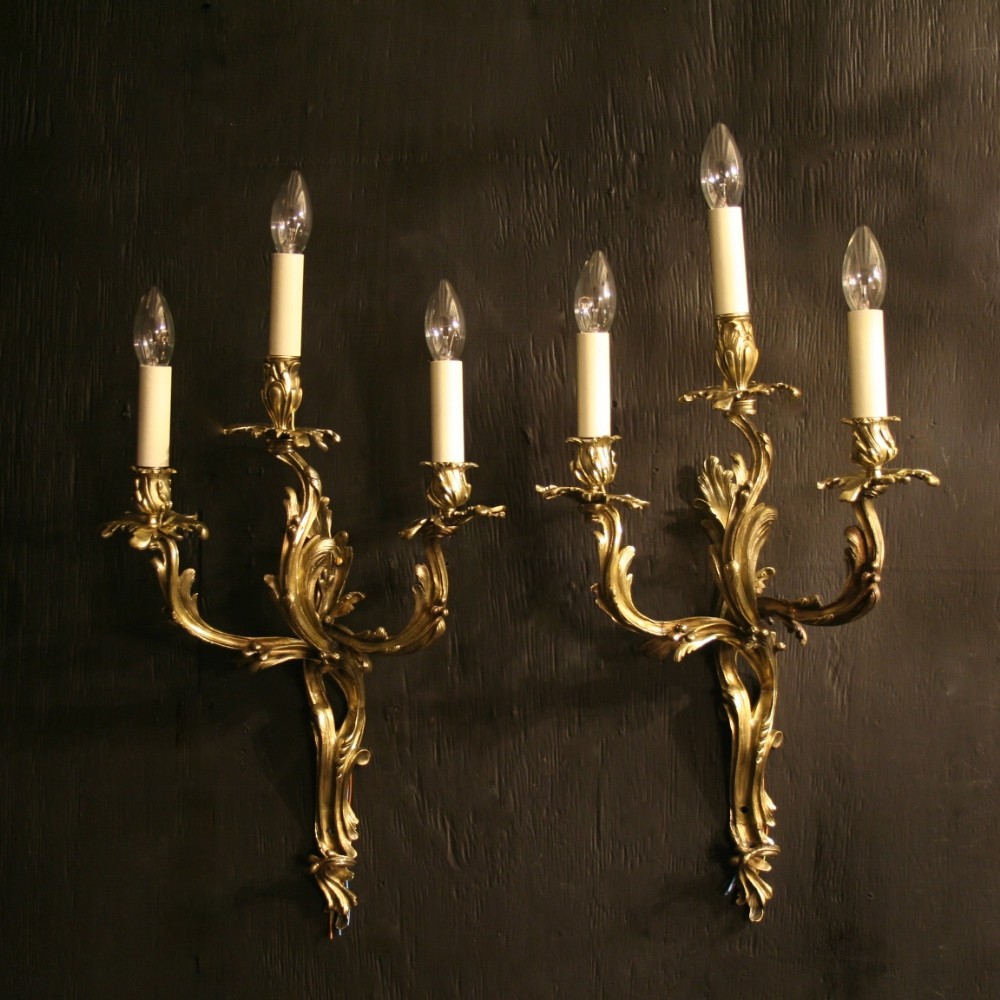 A French Pair Of Triple Arm Cast Brass Antique Wall Sconces