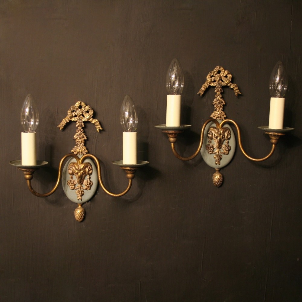 A French Pair Of Ram Headed Gilded Wall Lights