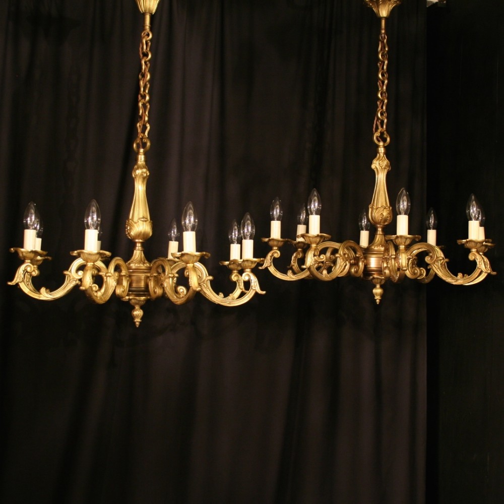A French Pair Of Gilded Bronze 8 Light Chandeliers