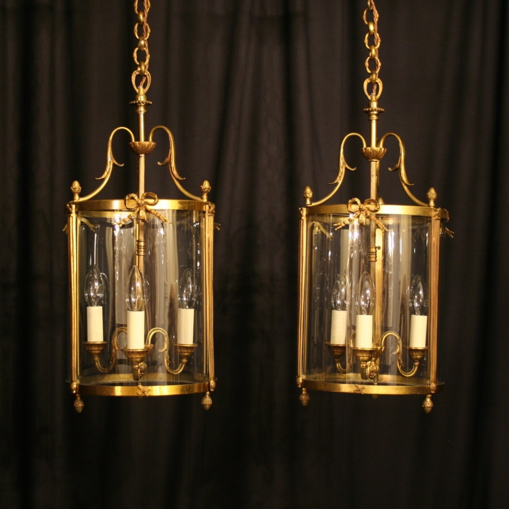A French Pair Of Gilded Triple Light Convex Antique Hall Lanterns