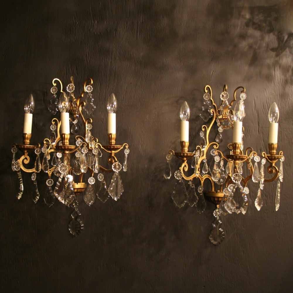 A French Pair Of Large Gilded Triple Arm Antique Wall Lights
