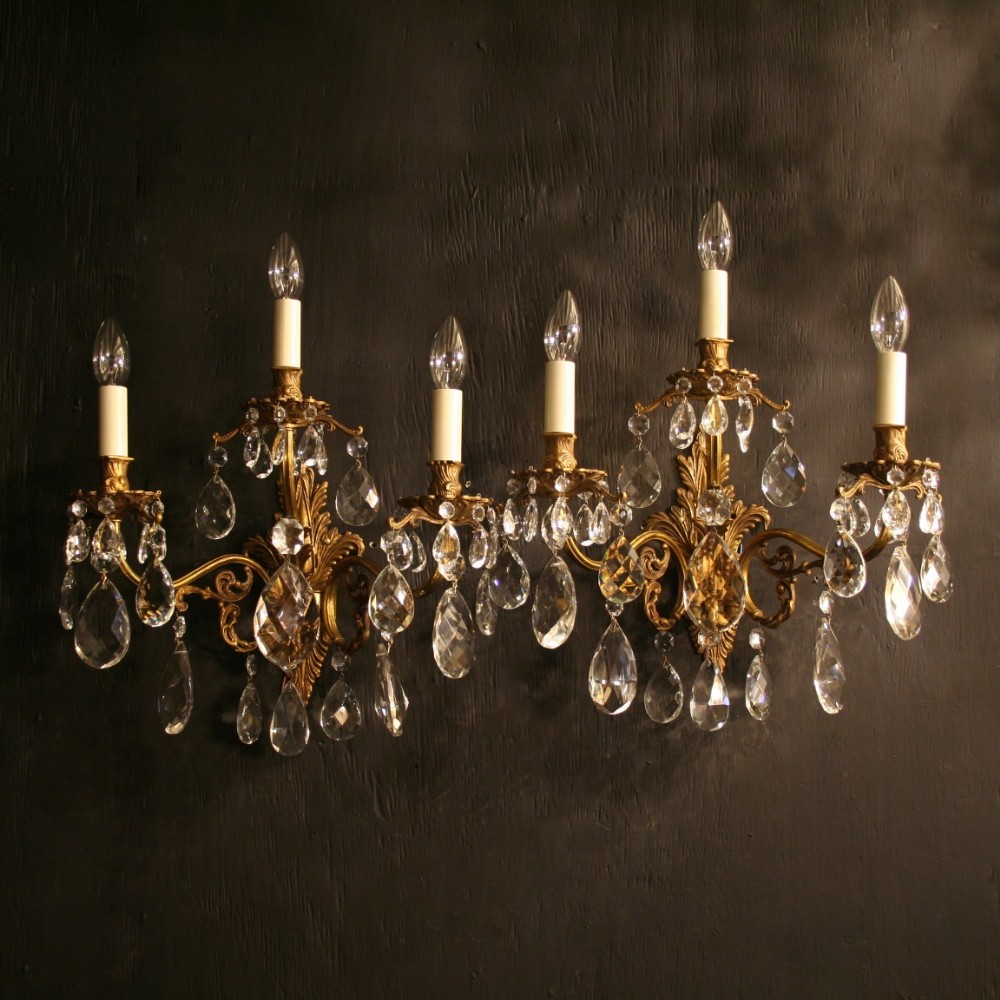 An Italian Pair Of Gilded Triple Arm Antique Wall Lights