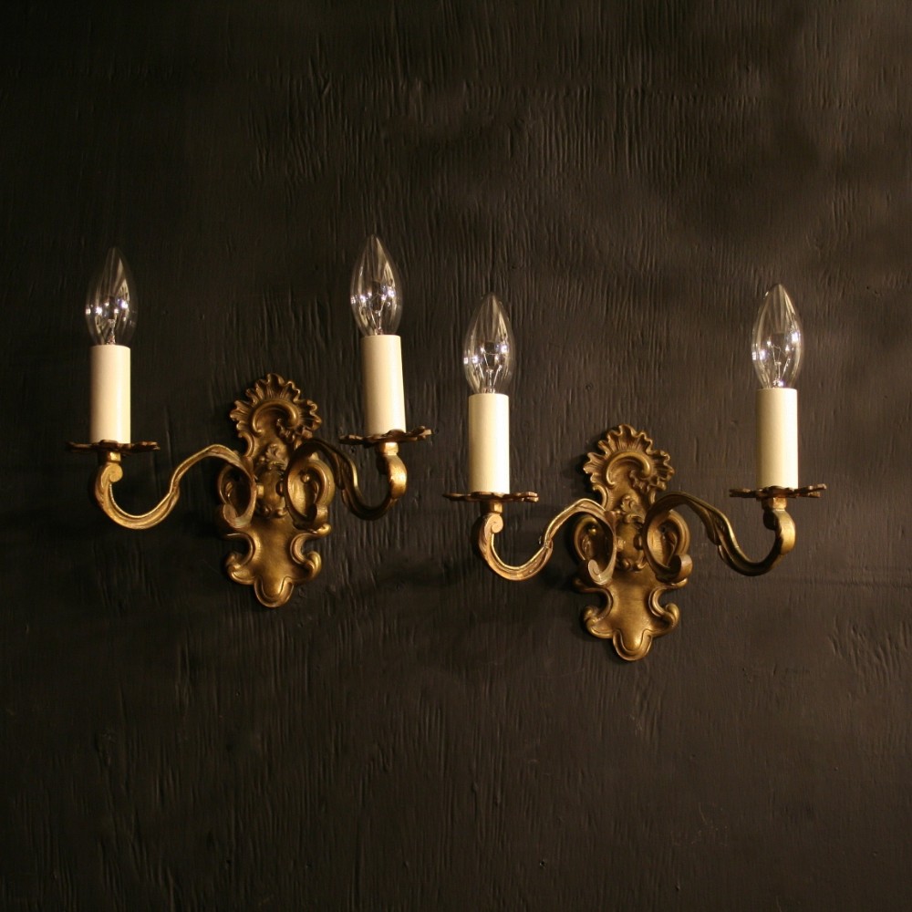 A French Pair Of Brass Twin Arm Antique Wall Lights