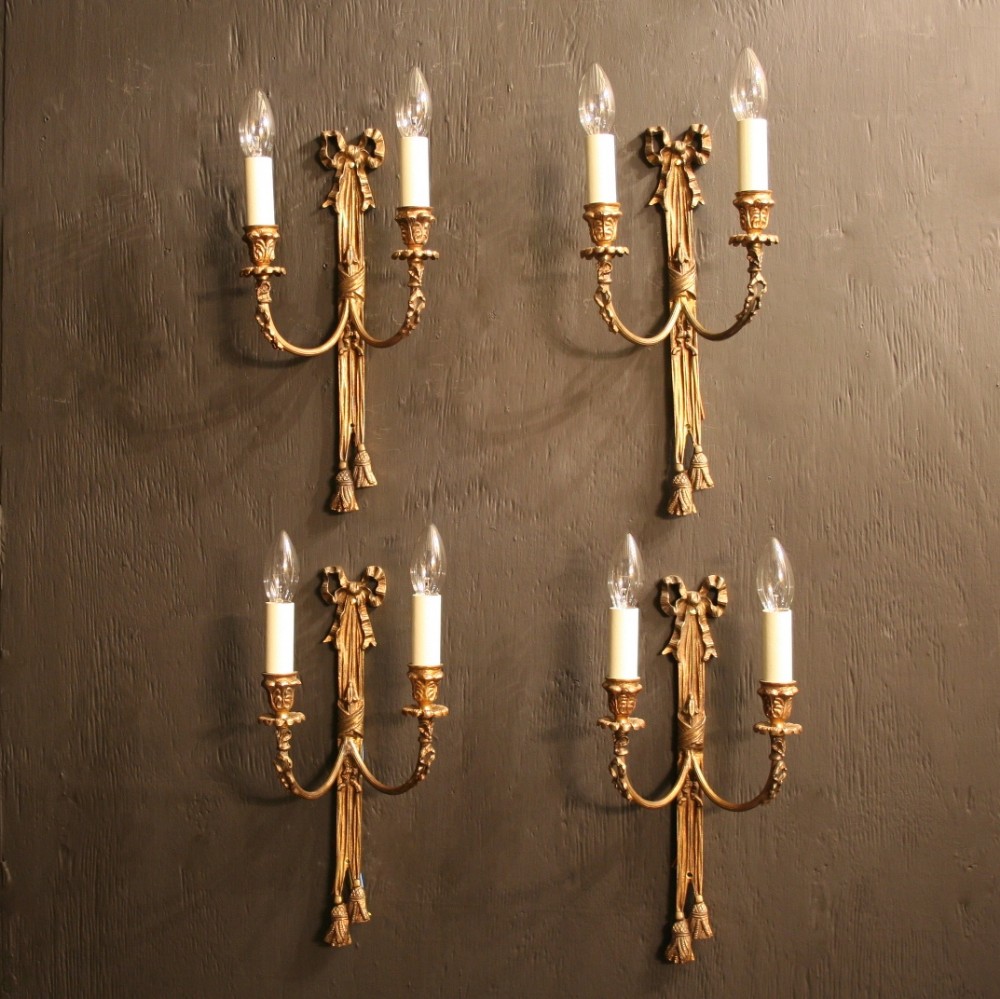 A French Set Of 4 Gilded Twin Arm Ribbon Wall Lights