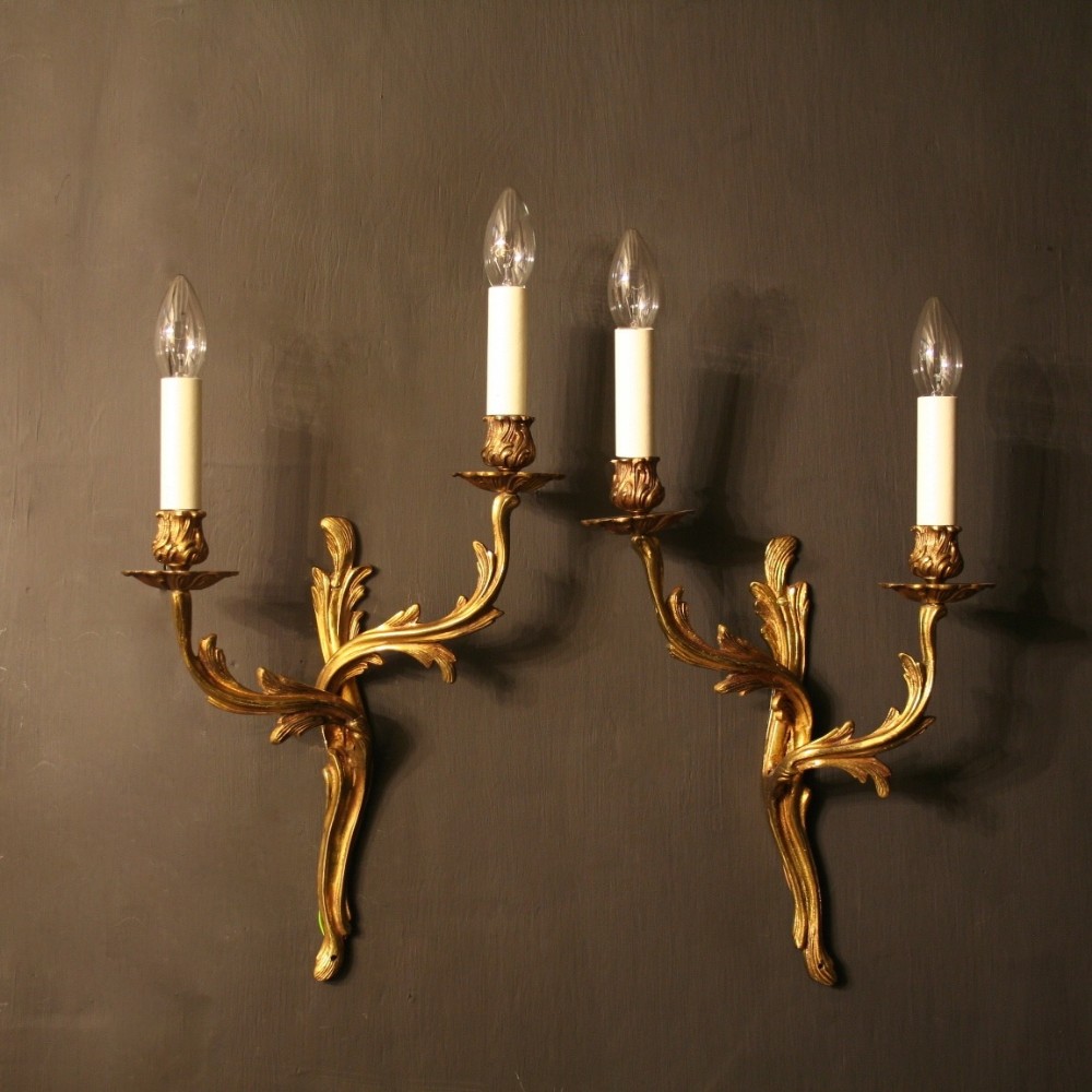 A French Pair Of Gilded Twin Arm Antique Wall Lights