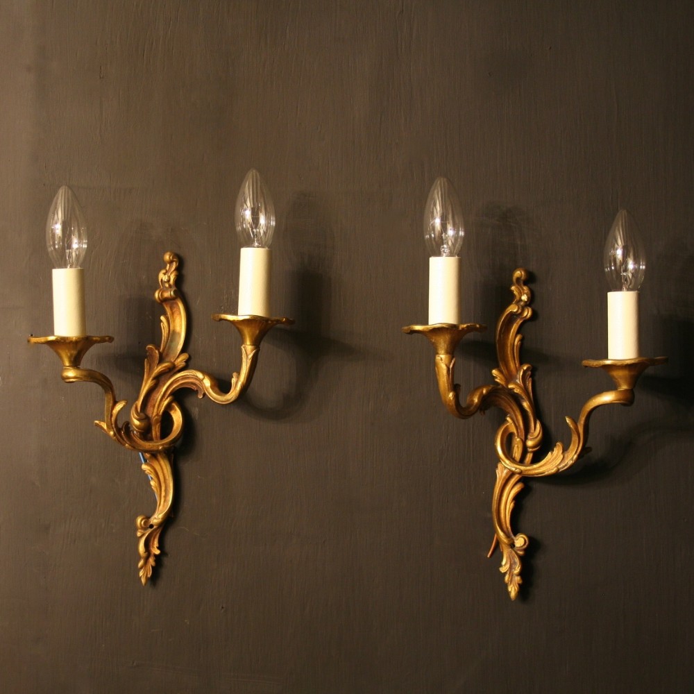 A French Pair Of Bronze Twin Arm Antique Wall Lights