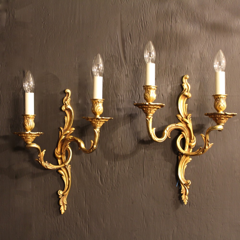 A French Pair Of Gilded Twin Arm Antique Wall Lights