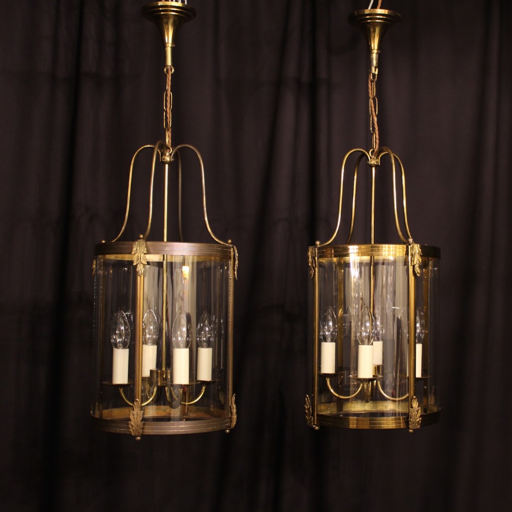 A French Pair Of Gilded 4 Light Convex Lanterns