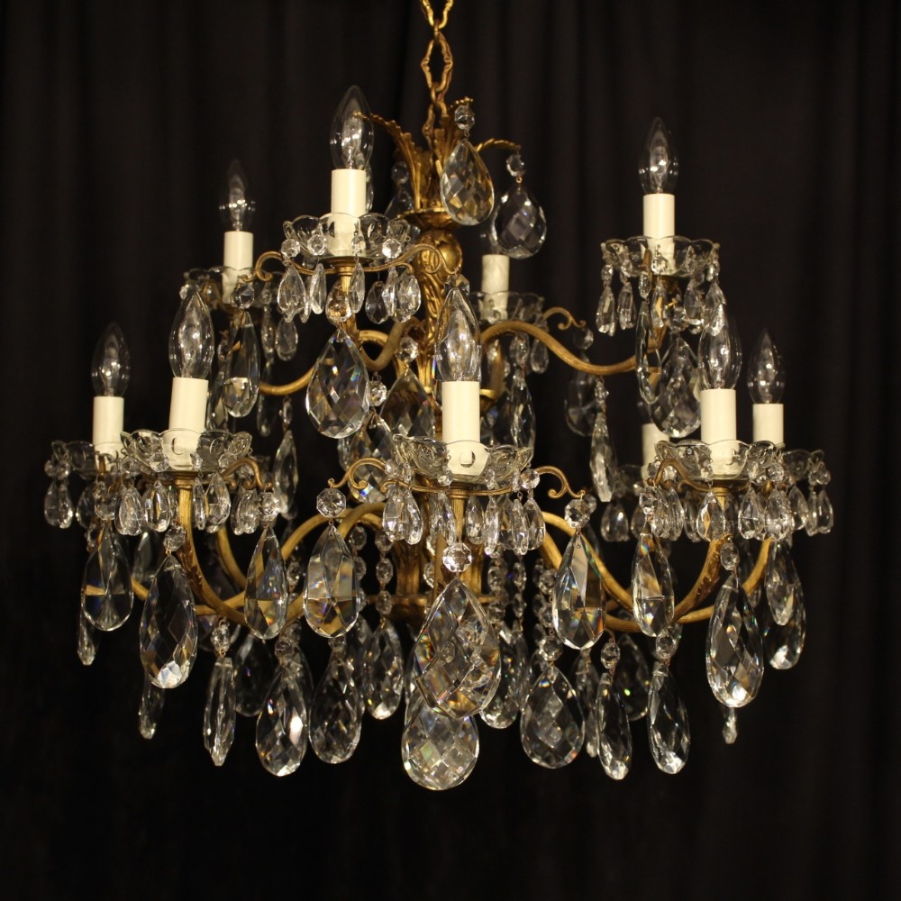 An Italian 12 Light Double Tiered Gilt & Crystal Antique Chandelier