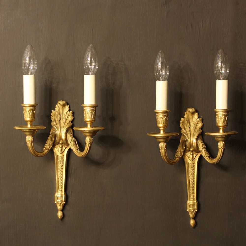 A French Pair Of Bronze Antique Wall Sconces