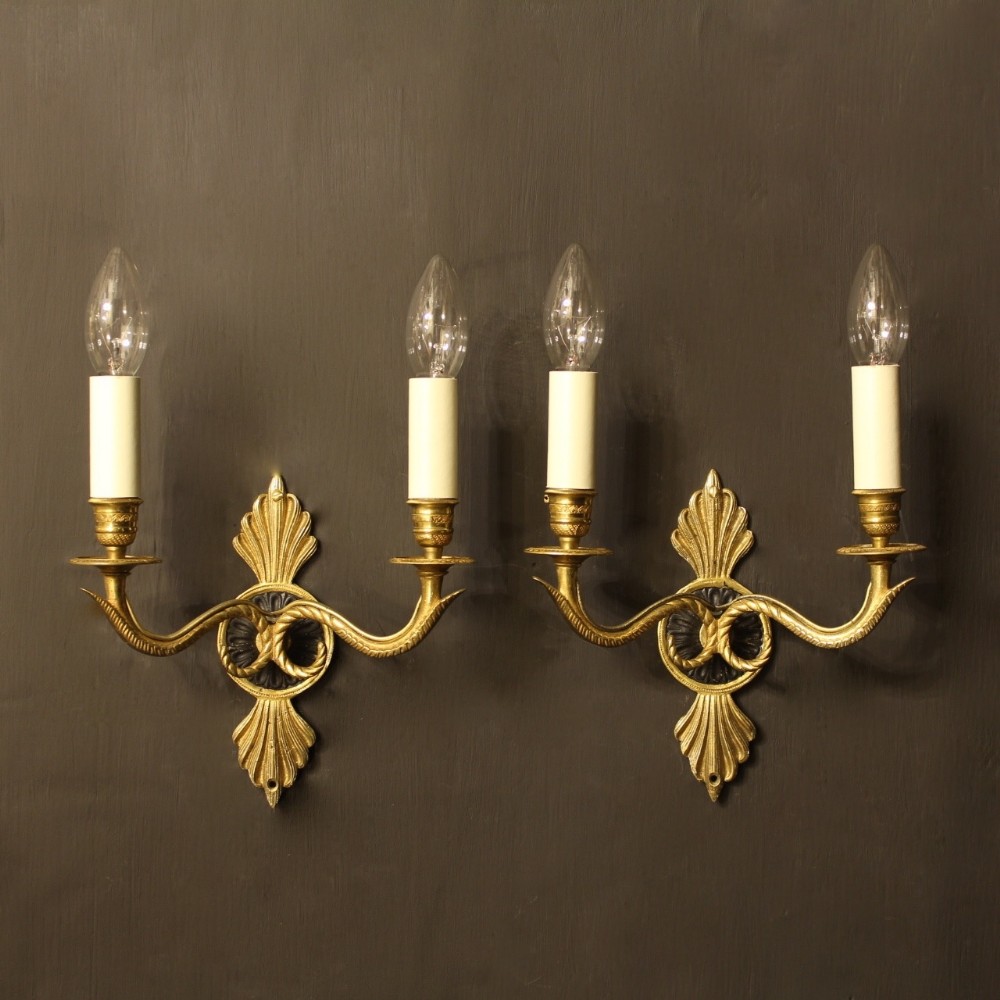 A French Pair Of Empire Gilded Wall Lights