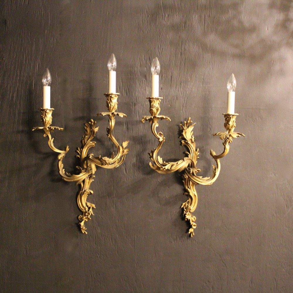 A French Pair Of Bronze Antique Wall Sconces