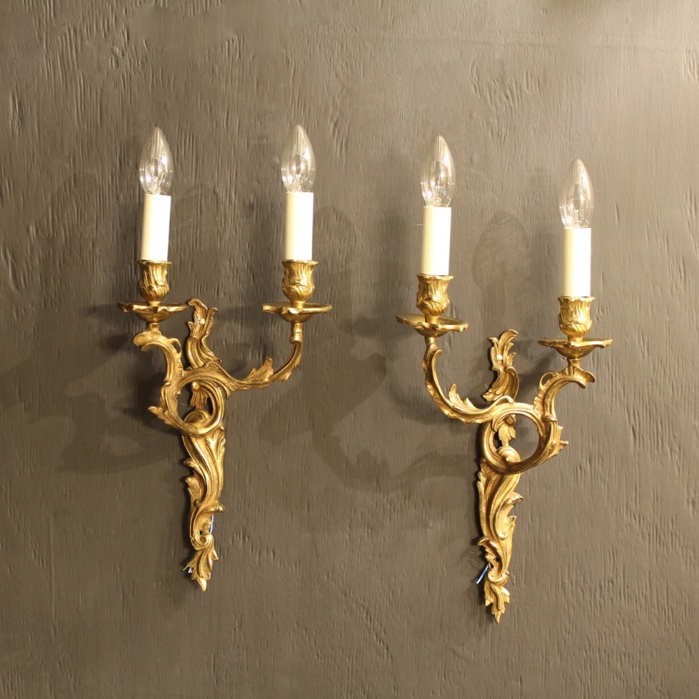 A French Pair Of Twin Arm Gilded Wall Lights