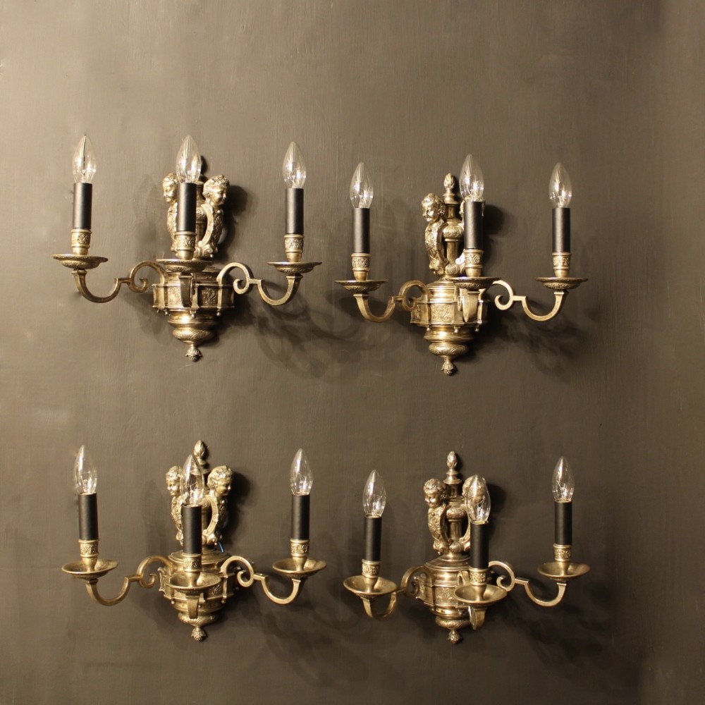 An English Set Of 4 Cherub Silver Wall Lights