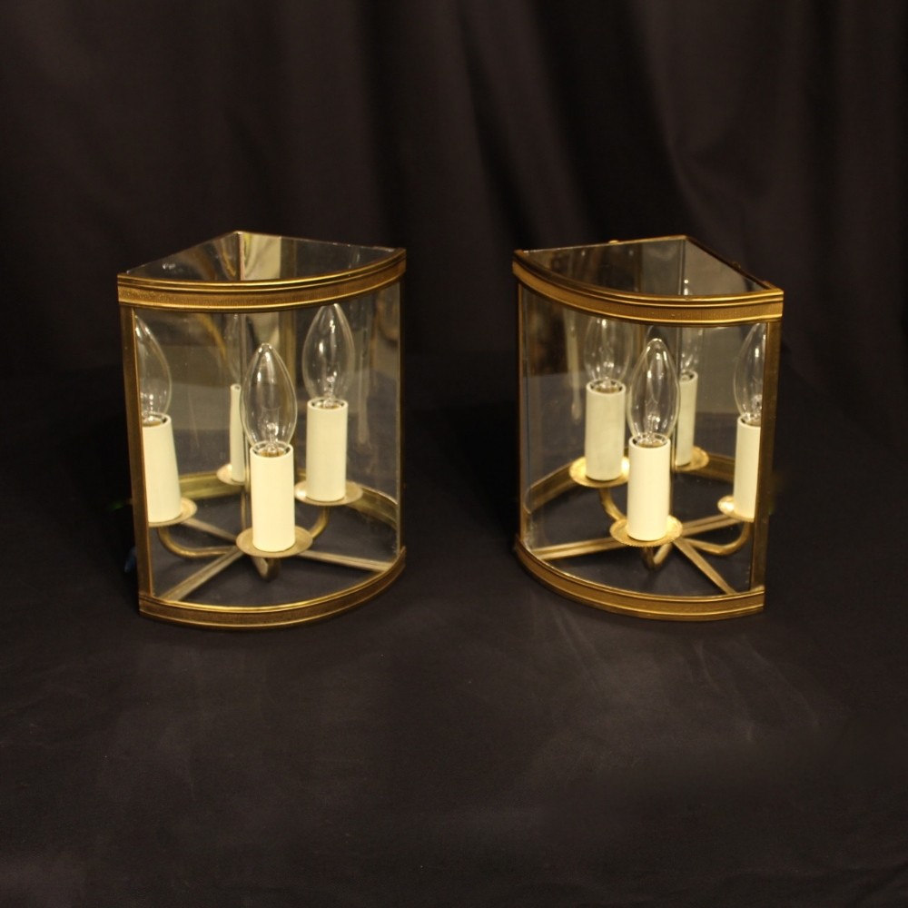 A French Pair Of Gilded Convex Corner Lanterns