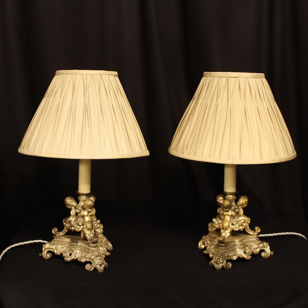 A French Silver Gilded Cherub Table Lamps
