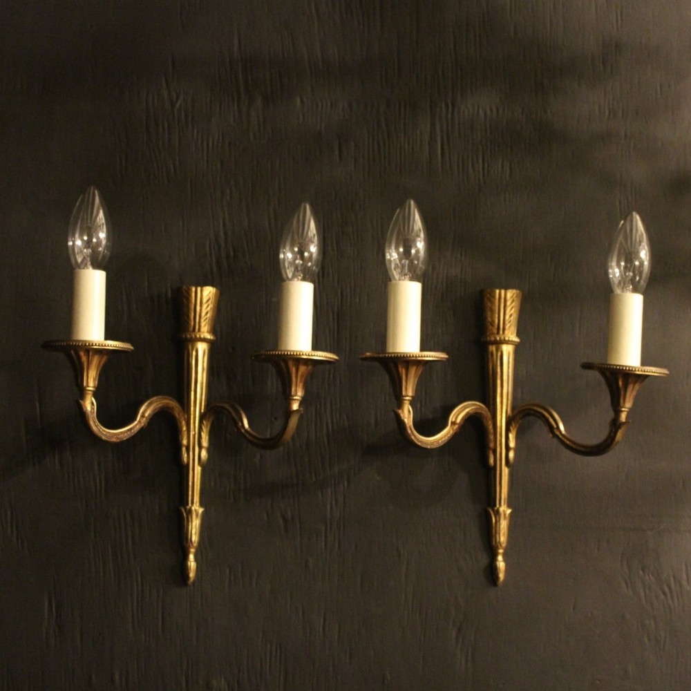 A French Pair Of Gilded Twin Arm Wall Lights