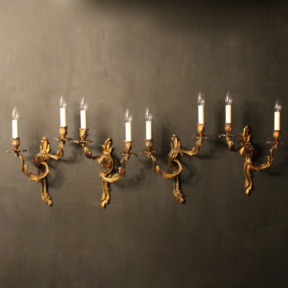A French Set Of 4 Gilded Twin Arm Antique Wall Sconces