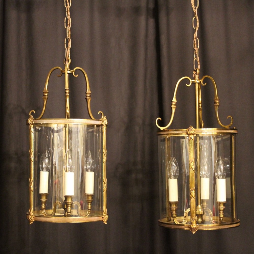 A French Pair Of Gilded Antique Hall Lanterns