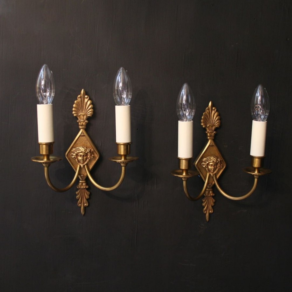 A French Pair Of Gilded Twin Arm Antique Wall Lights