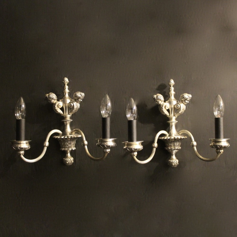 An English Pair Of Cherub Silver Wall Lights