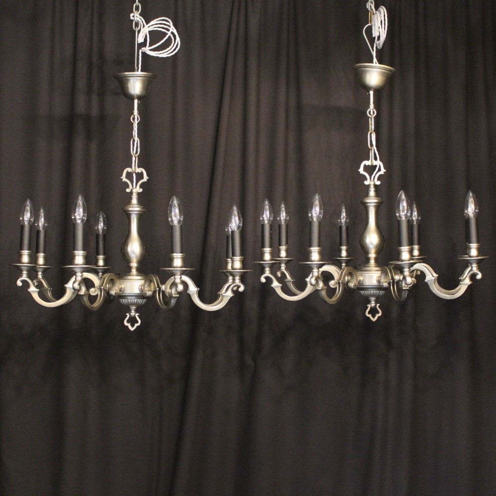 A French Pair Of Pewter 8 Light Chandeliers