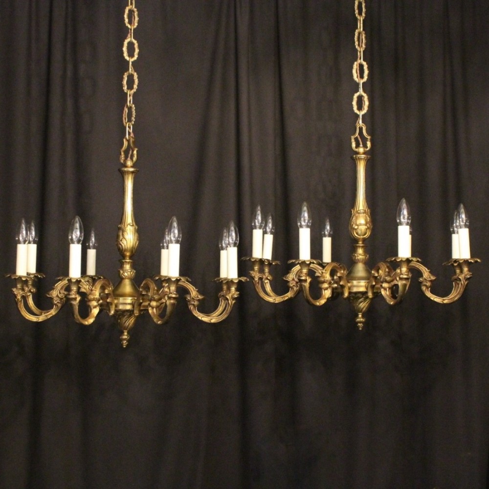 A French Pair Of Bronze 8 Light Chandeliers