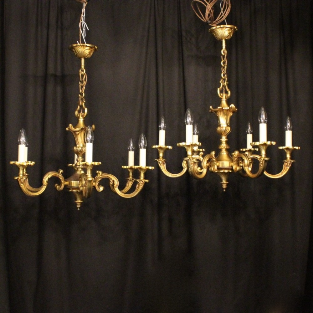A French Pair Of Gilded Bronze 6 Light Chandeliers