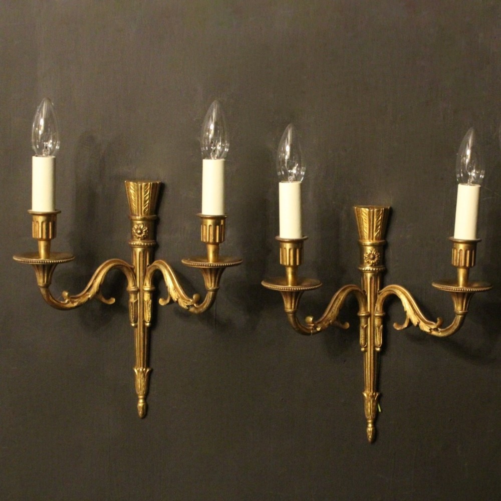 A French Pair Of Twin Arm Gilded Antique Wall Lights