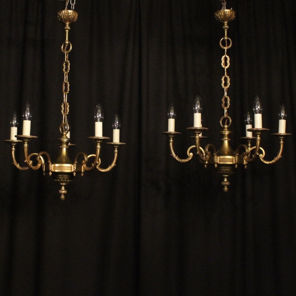 A French Pair Of Gilded Chandeliers