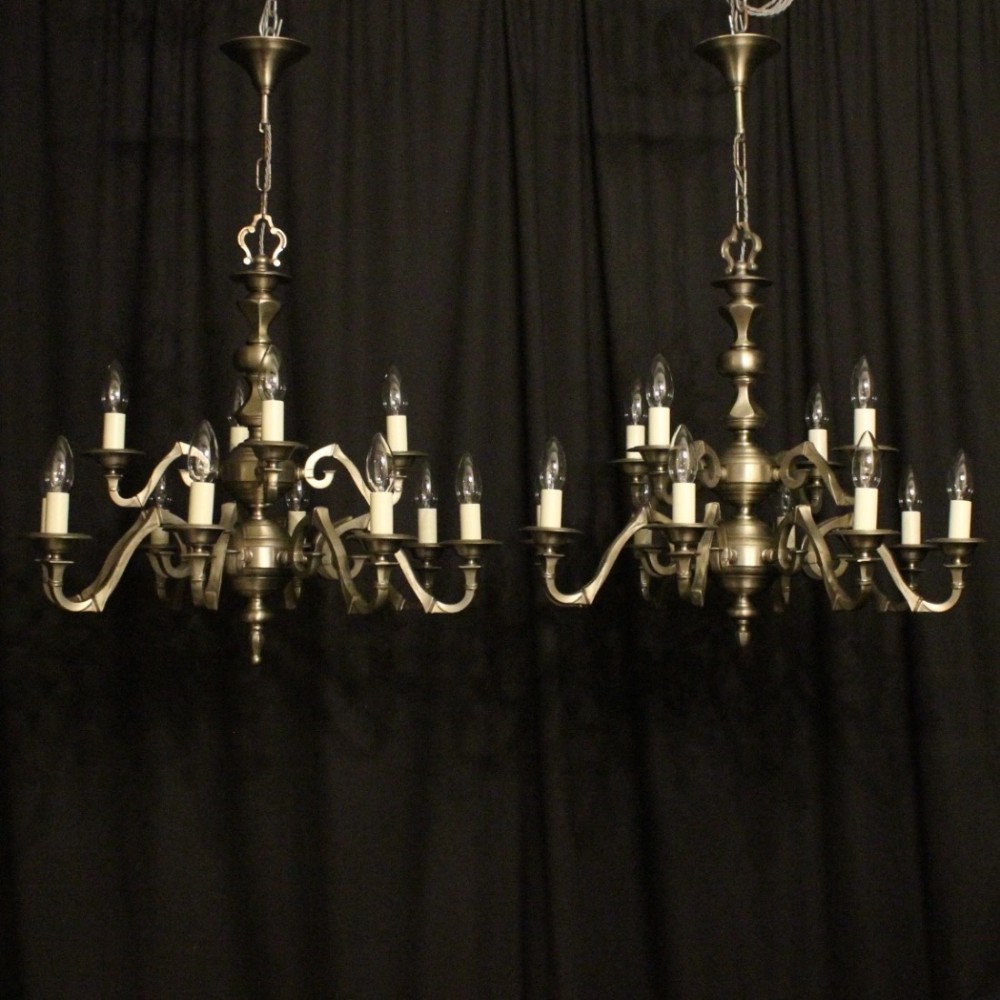 Flemish Pair Silver 12 Light Chandeliers
