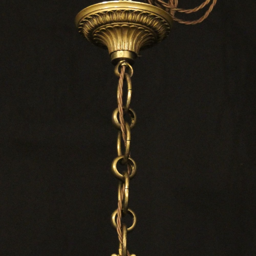 A French gilt bronze cylindrical hall lantern with curved glass panels and internal candle sockets. View X