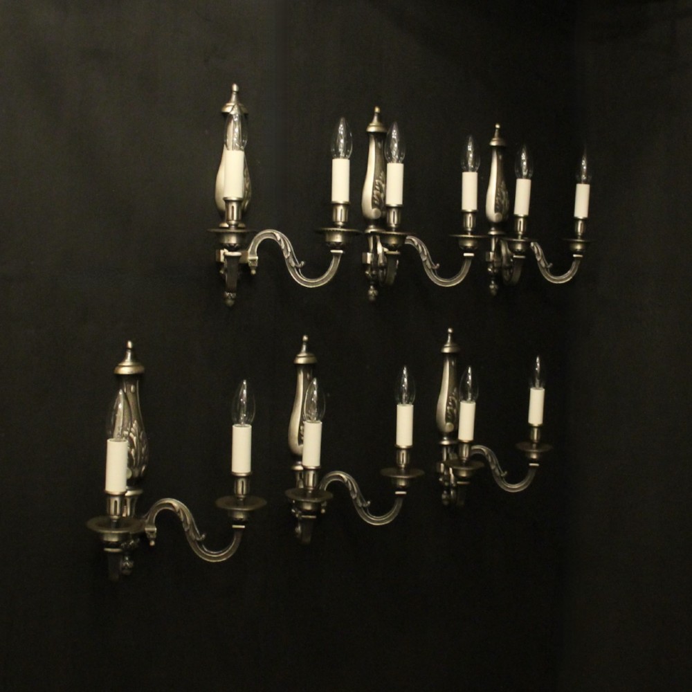 A set of six French twin-branch wall lights crafted from silver gilded metal with central acanthus backplates. View IX