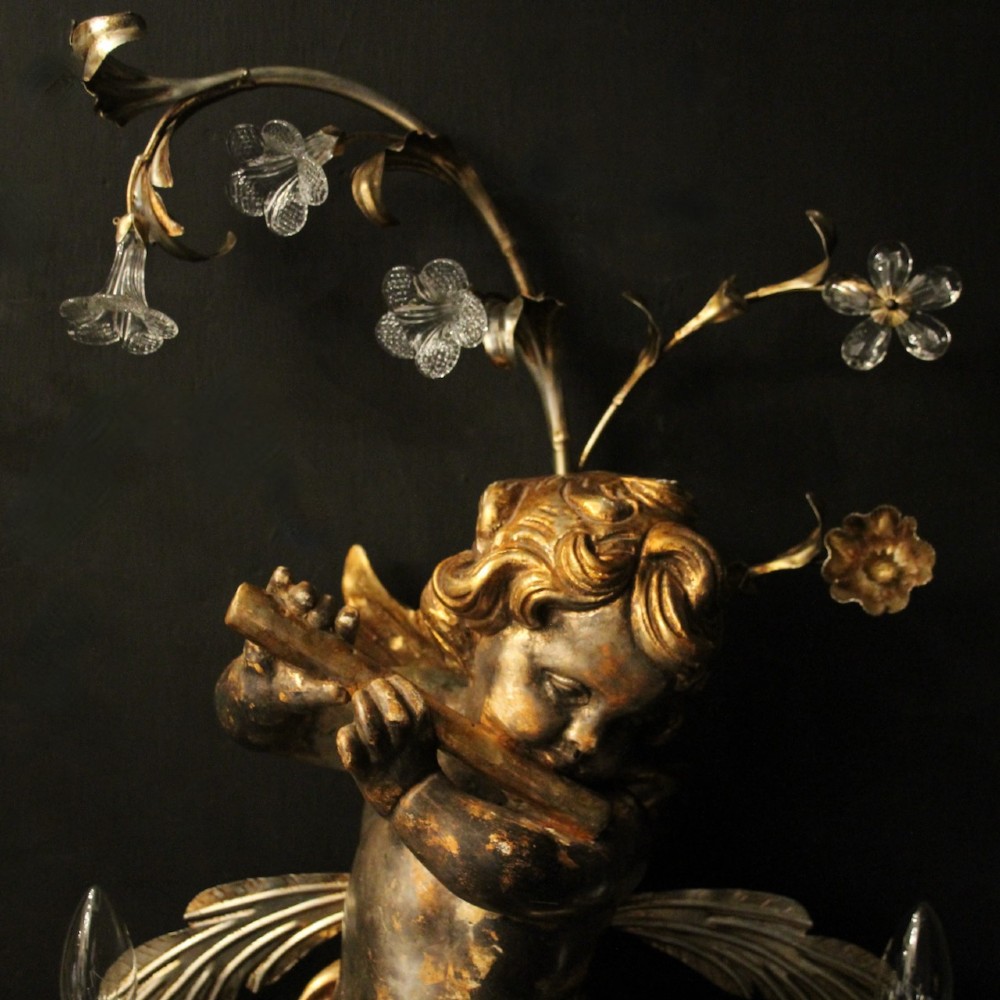 Pair of Italian giltwood wall sconces featuring sculpted cherubs playing musical instruments framed by metal branches with clear glass flowers. View VII