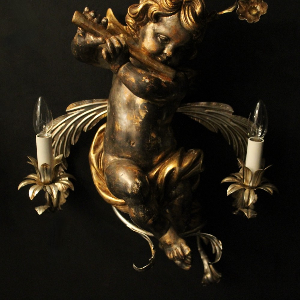 Pair of Italian giltwood wall sconces featuring sculpted cherubs playing musical instruments framed by metal branches with clear glass flowers. View VIII