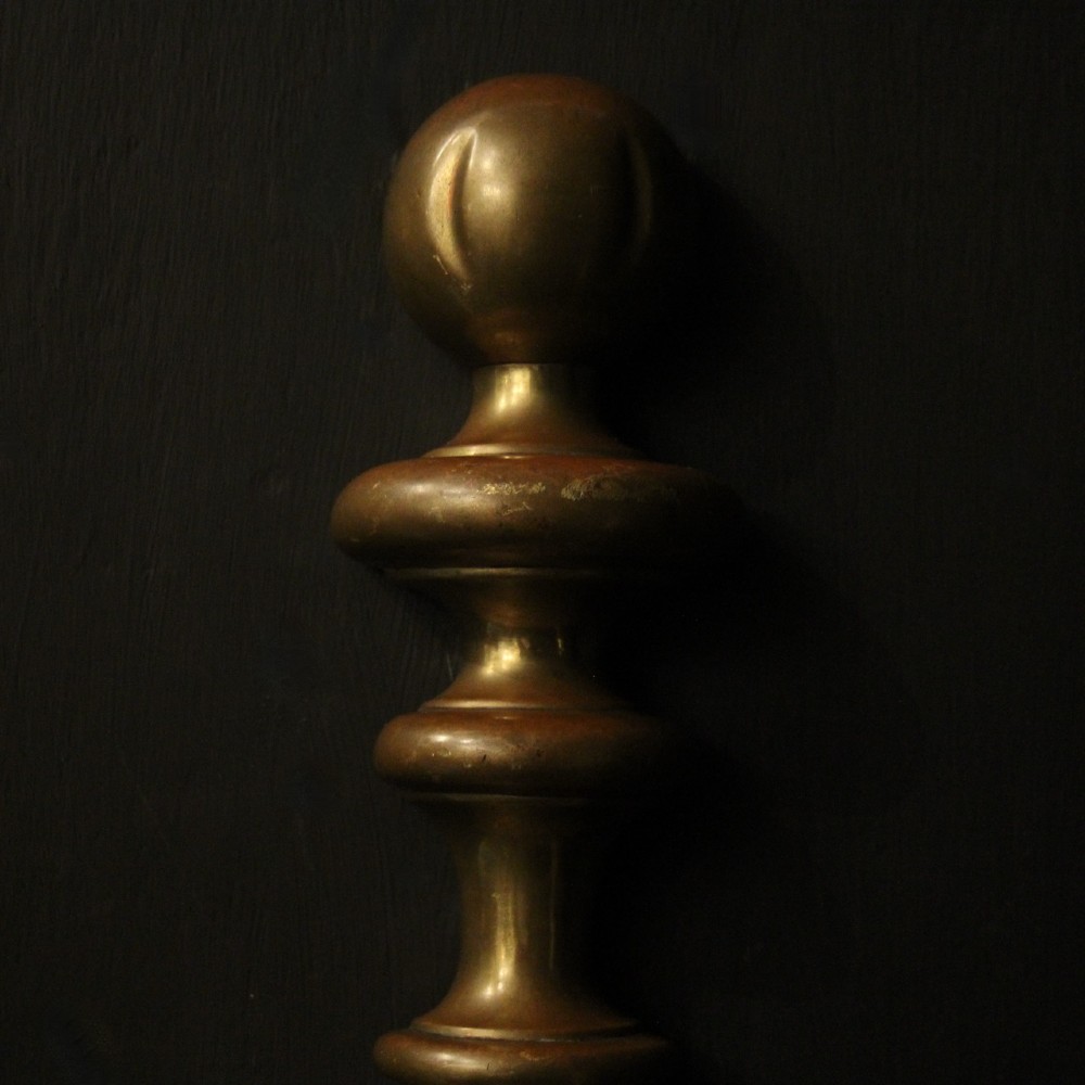 A set of three antique bronze wall sconces, each featuring a turned central baluster and two scrolled arms holding candle-style bulb holders. View VII