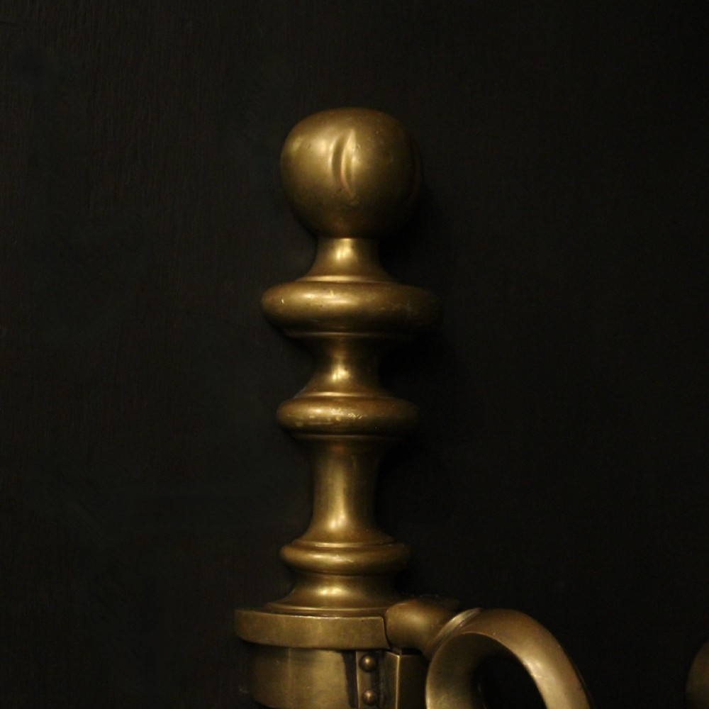 A pair of antique bronze single-arm wall lights with turned baluster shafts and candle-style fittings against a dark background. View VIII