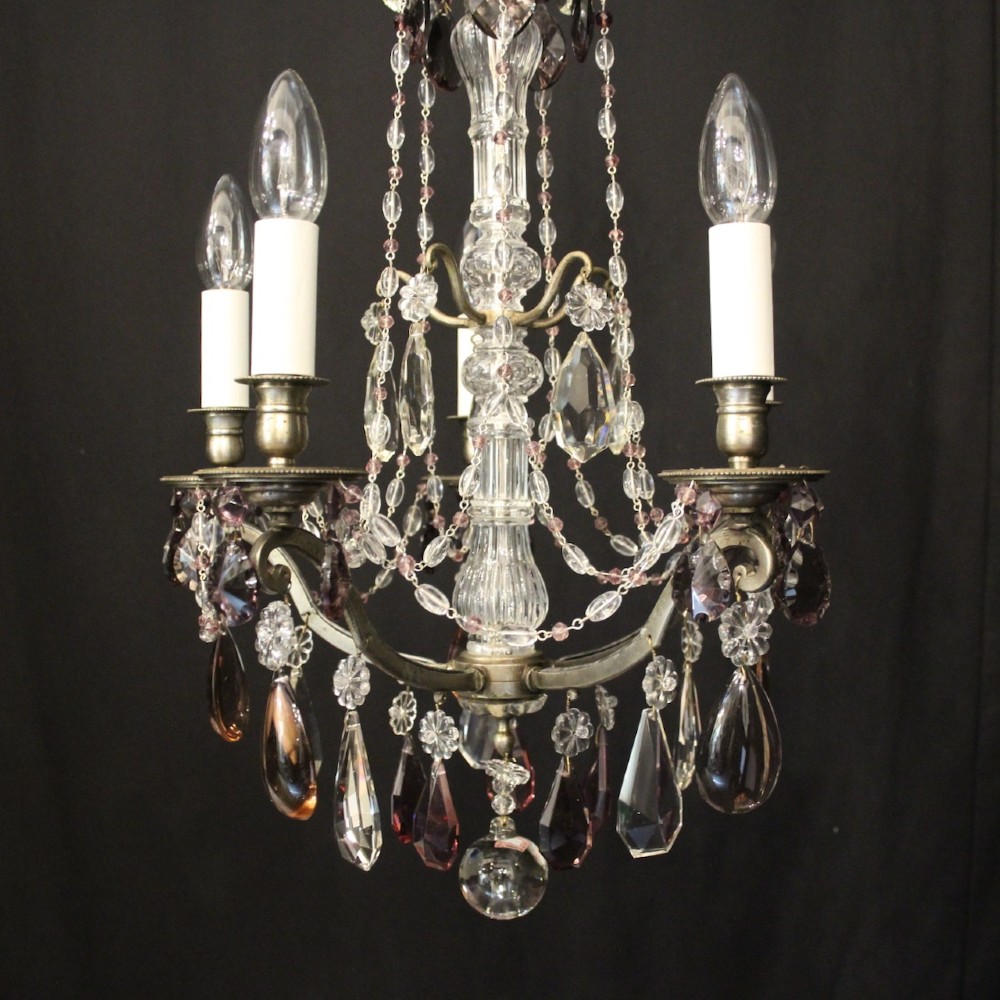 An antique French silver gilt five-light chandelier with clear and tinted crystal teardrop pendants, bead strands, and candle-style bulb sockets. View II