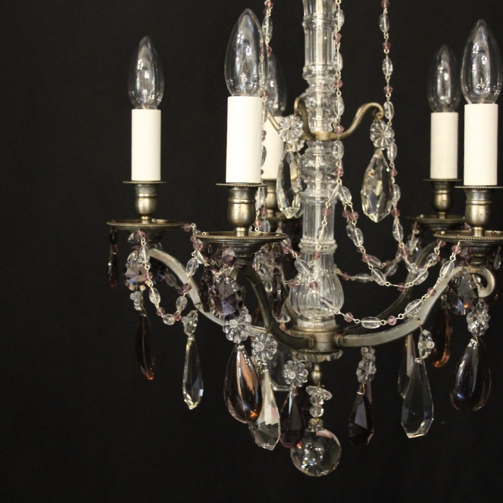 An antique French silver gilt five-light chandelier with clear and tinted crystal teardrop pendants, bead strands, and candle-style bulb sockets. View IV