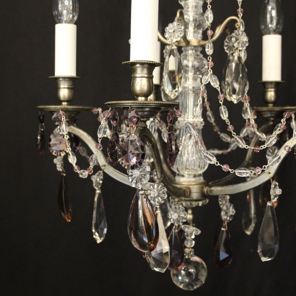 An antique French silver gilt five-light chandelier with clear and tinted crystal teardrop pendants, bead strands, and candle-style bulb sockets. View V