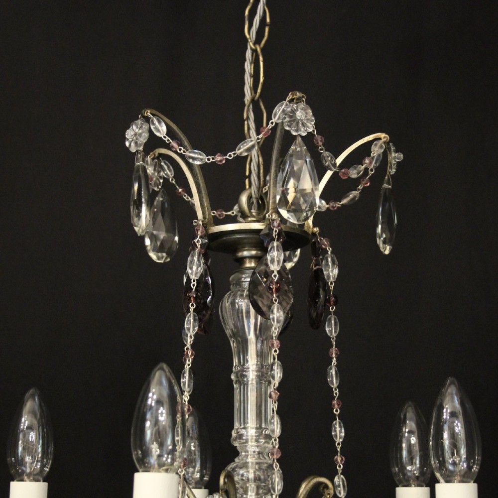 An antique French silver gilt five-light chandelier with clear and tinted crystal teardrop pendants, bead strands, and candle-style bulb sockets. View X