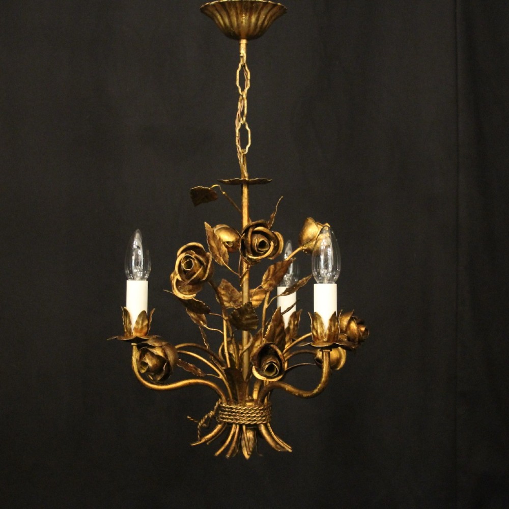 A French gilt metal triple-light chandelier styled with hand-formed metal rose blossoms, leaves, and a tied sheaf motif at the base. View II