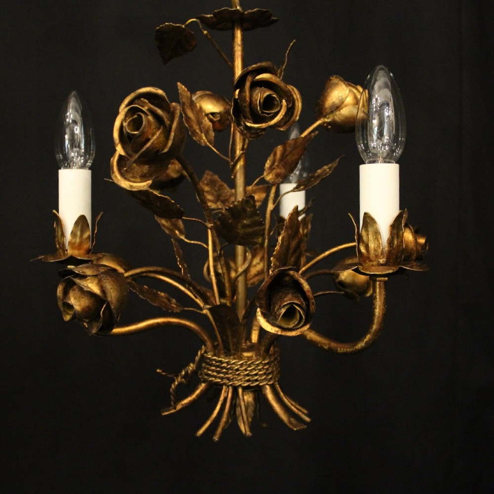 A French gilt metal triple-light chandelier styled with hand-formed metal rose blossoms, leaves, and a tied sheaf motif at the base. View III