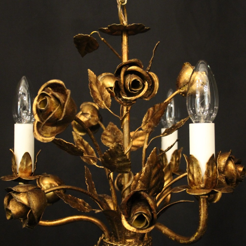 A French gilt metal triple-light chandelier styled with hand-formed metal rose blossoms, leaves, and a tied sheaf motif at the base. View IV