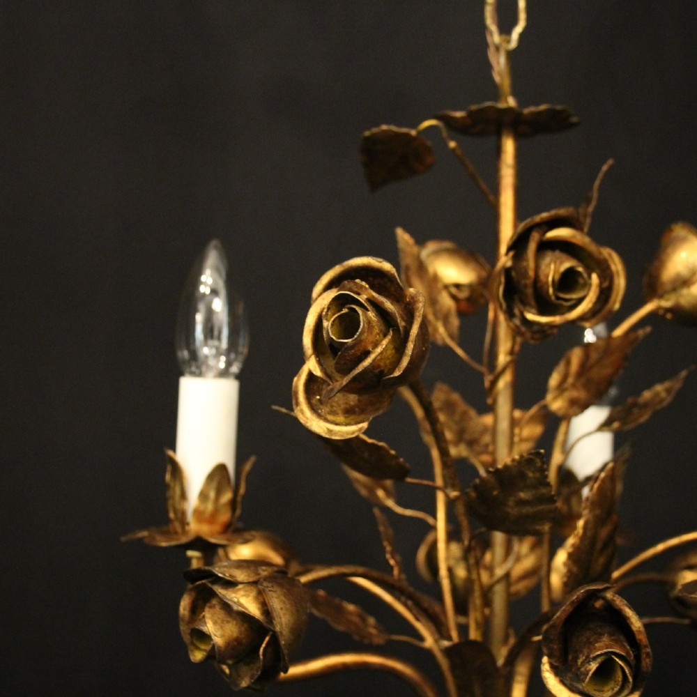 A French gilt metal triple-light chandelier styled with hand-formed metal rose blossoms, leaves, and a tied sheaf motif at the base. View V