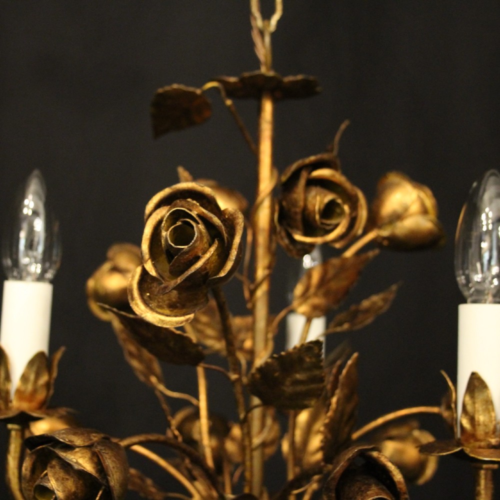 A French gilt metal triple-light chandelier styled with hand-formed metal rose blossoms, leaves, and a tied sheaf motif at the base. View VI